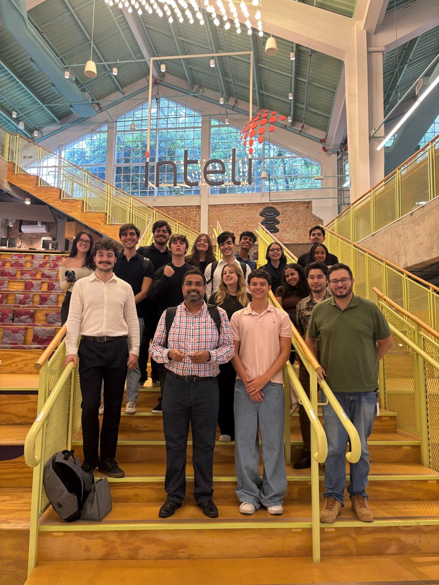 The INTELI cohort in São Paulo, on the stairs of the institute's atrium.